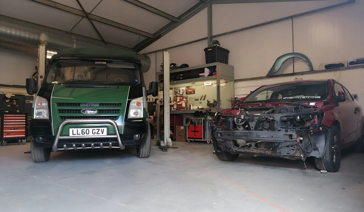 Two Vehicles In Shop